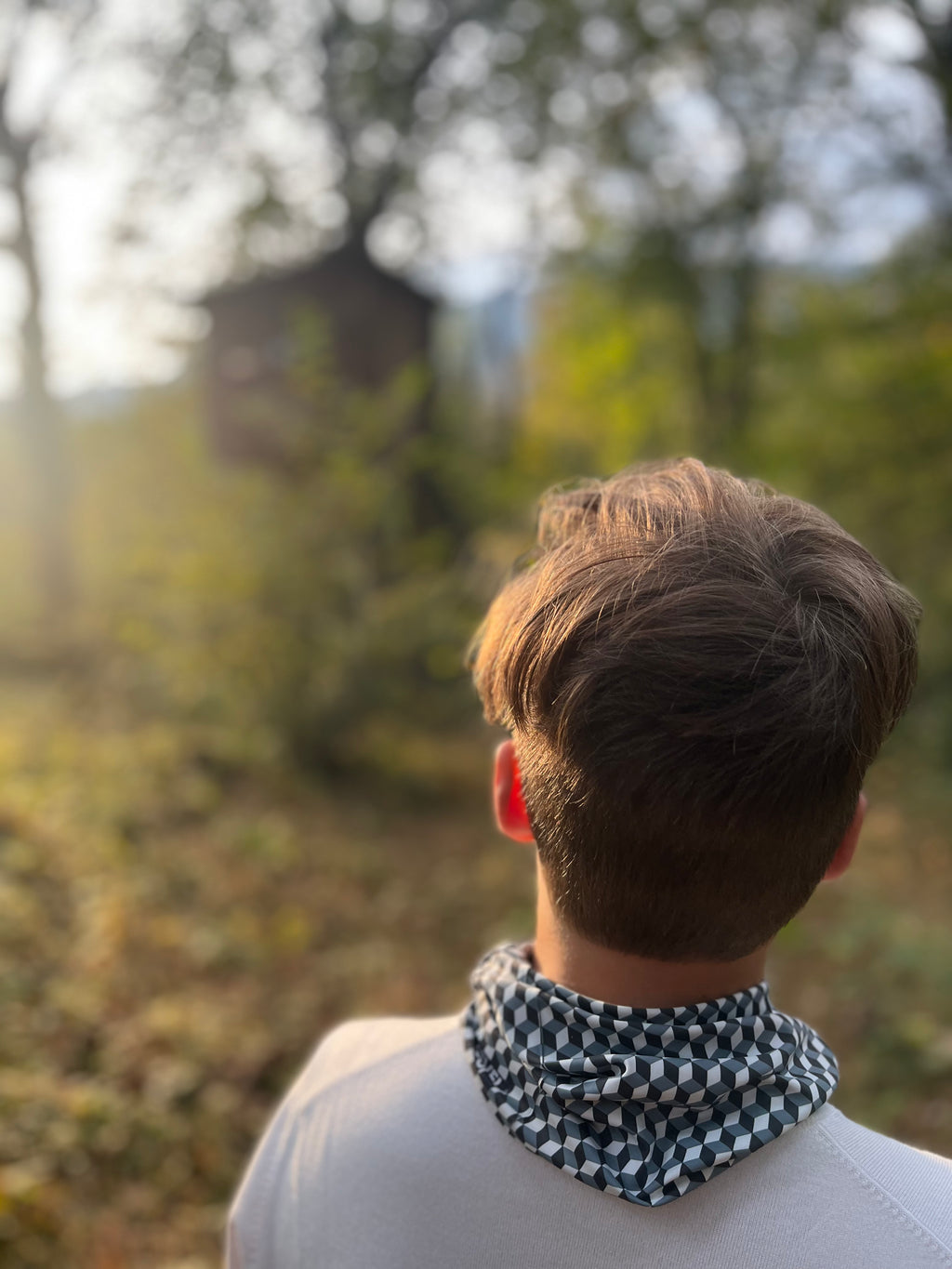 boy wearing a geometric neckwear in autumn sunlight