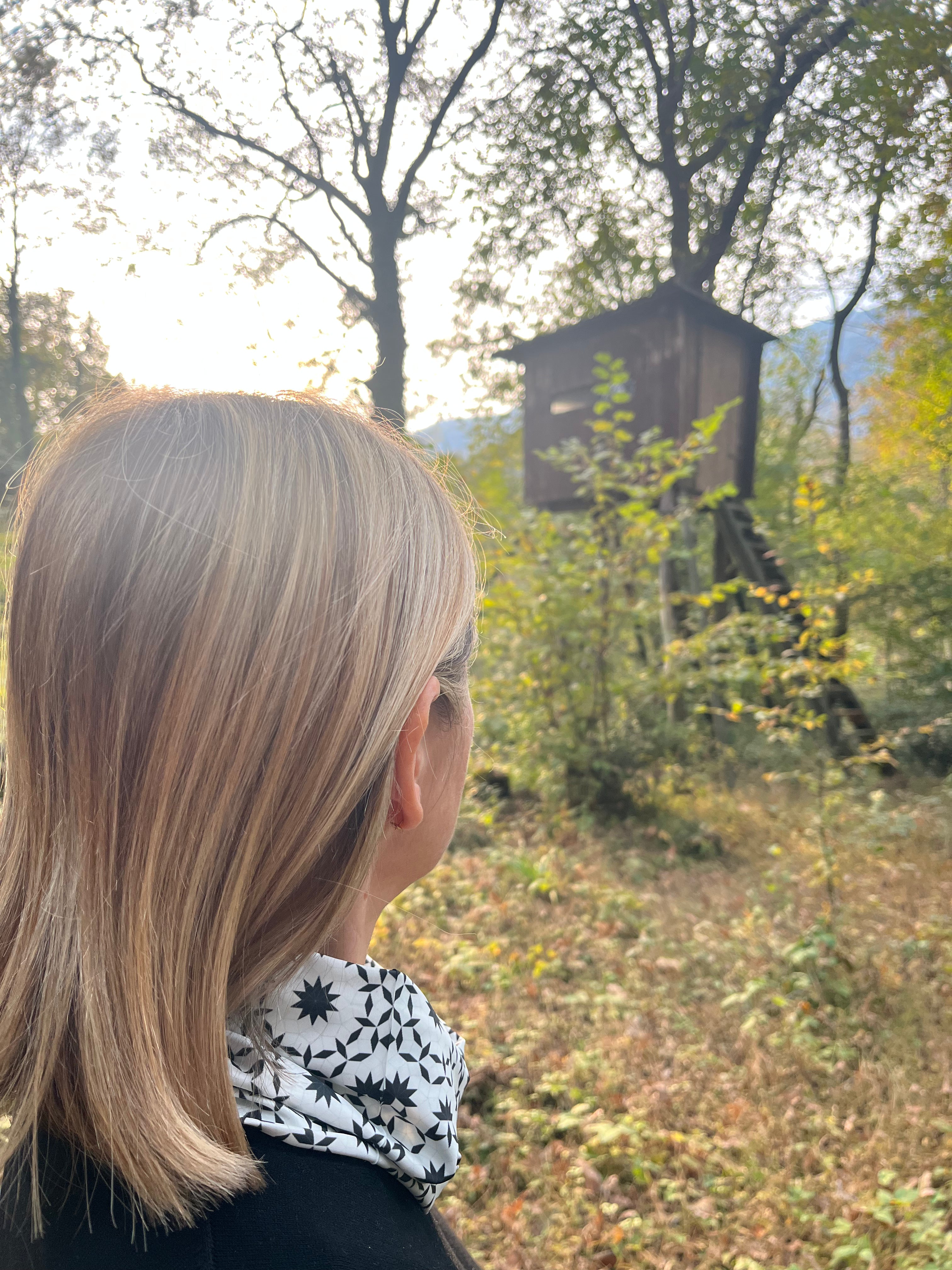 woman wearing geometric neckwear in the countryside