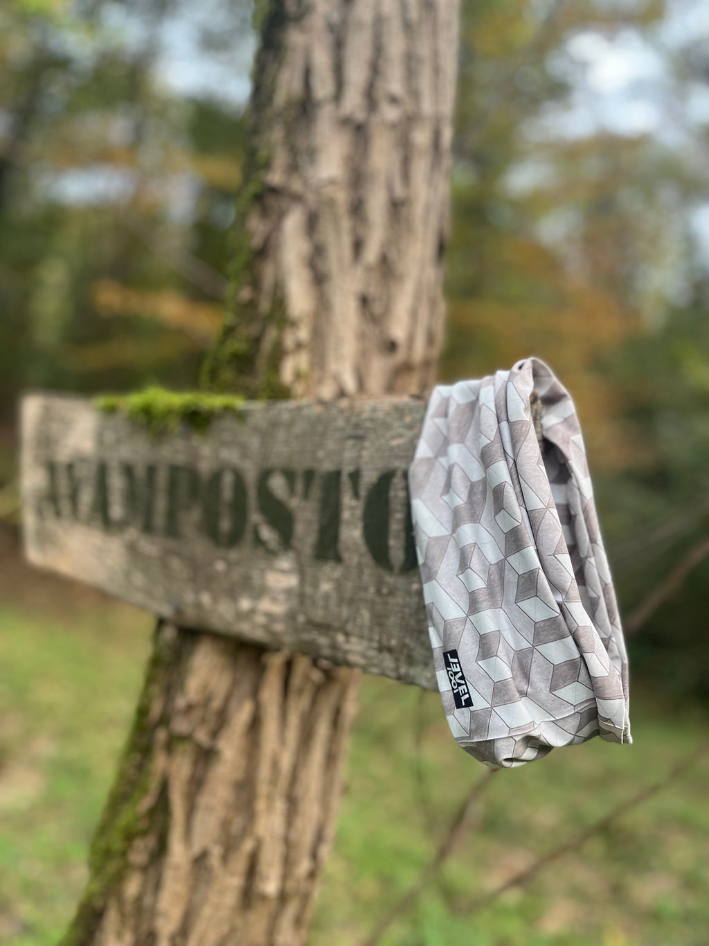 close up of geometric neckwear in the woods